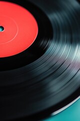 Red vinyl record on turntable. Analog audio sound quality for music enthusiasts.