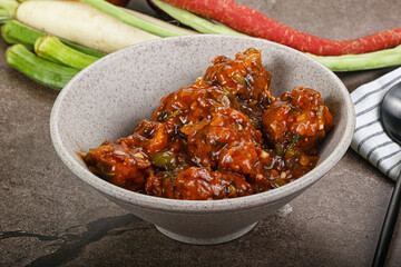 Manchurian chicken with sauce and spices