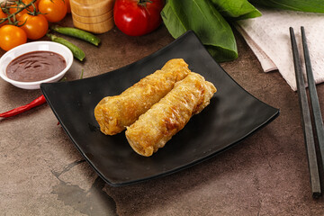 Vietnamese stuffed spring roll served sauce