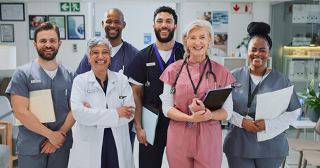 Healthcare, smile and group with documents, clinic and diversity of staff, portrait and collaboration. Teamwork, professional and people with joy, women and men with interns, hospital and together
