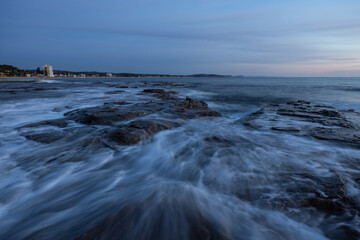 Cloudy morning view at the rocky shore.