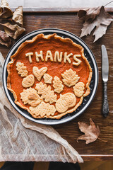 preparation process of Thanksgiving Pumpkin pie with autumn leaves decor