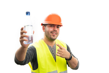 Builder man smiling pointing finger at plastic water bottle