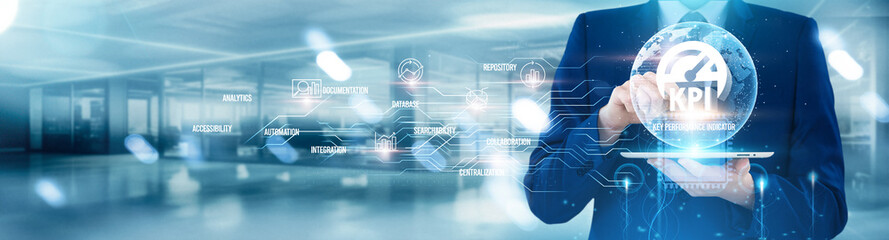 Key Performance Indicator. Man using tablet with KPI, data analysis tracking, performance metrics, business dashboard, goal monitoring, reporting system visualization.