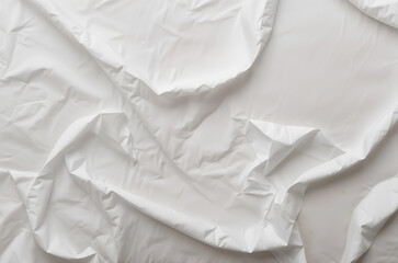 Obraz premium A wrinkled white paper texture on a clean surface, perfect for backgrounds and design concepts. Generative AI
