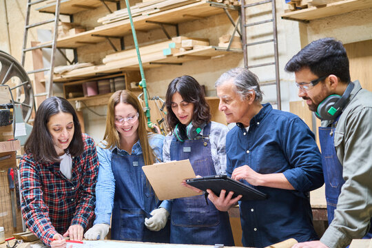 Diverse team working together in a collaborative lumberyard setting
