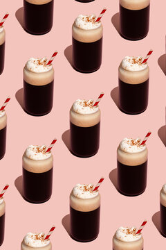 Pattern of frothy coffee with cream on pink background