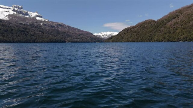 Panoramic drone view flying over water of Falkner Lake in Nahuel Napi National Park. Argentina. 4k.