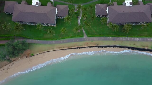 Beautiful Kapaa Beach Park with turquoise blue water and sandy beach. Top down View of kappa beach in Kauai Hawaii. Aerial view of tropical Hawaiian beach with turquoise blue water