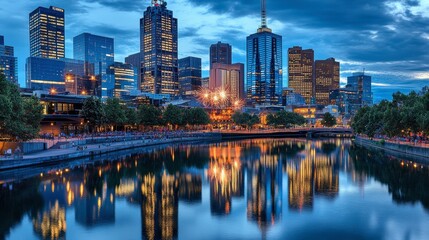 Fototapeta premium Stunning Evening Skyline Reflection of Melbourne with Towering Skyscrapers, Calm River Waters, and Vibrant City Lights Illuminating the Urban Landscape