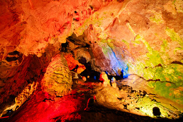 lights illuminate colorful stalagmites and stalactites inside vrelo cave, creating a magical atmosphere in Matka canyon, a popular tourist destination in Macedonia