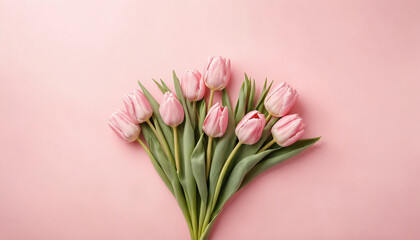 Fototapeta premium Beautiful composition spring flowers. Bouquet of pink tulips flowers on pastel pink background. Valentine's Day, Easter, Birthday, Happy Women's Day, Mother's Day. Flat lay, top view, copy space