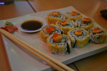 Sushi rolls with a soy sous