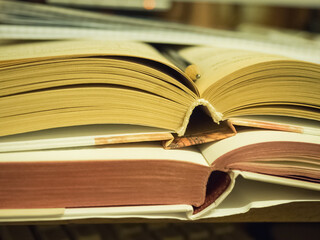 Several open books lying on the table