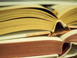 Several open books lying on the table