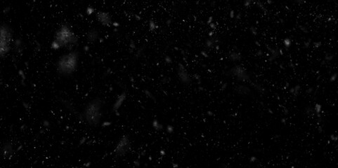 aged grunge concrete cement wall background,  many water drops in the air, falling snowflakes towards on black background, Scattered flour on a black background.