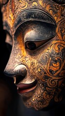 Fototapeta premium Detailed craftsmanship of a Balinese wooden mask highlights its unique etching and rich paintwork