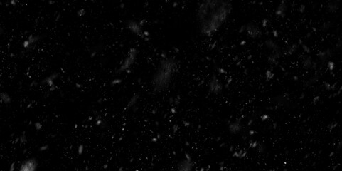 aged grunge concrete cement wall background,  many water drops in the air, falling snowflakes towards on black background, Scattered flour on a black background.