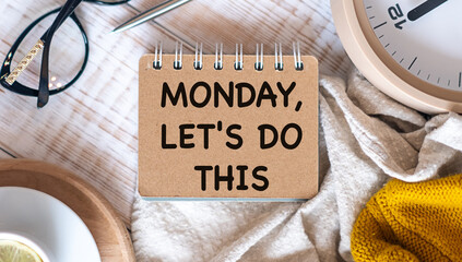 MONDAY LET'S DO THIS concept text Banner blue envelope with white cup of coffee and marshmallows on wooden background. The most depressing day of the year in January. © Pawel