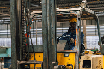 Industrial worker indoors in old factory. Industrial man Engineers in Hard Hats.Work at the Heavy Industry Manufacturing Factory.