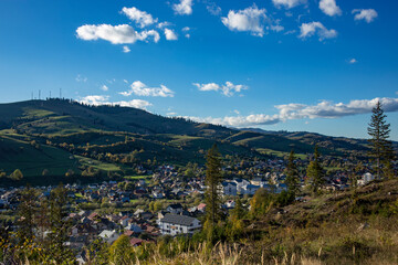 landscape of Gura Humorului Romania, with hills and houses at sunset