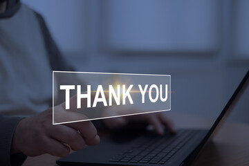 Hand pointing at a glowing 'Thank You' message on a digital interface, symbolizing gratitude, appreciation, and positive communication in a virtual environment.