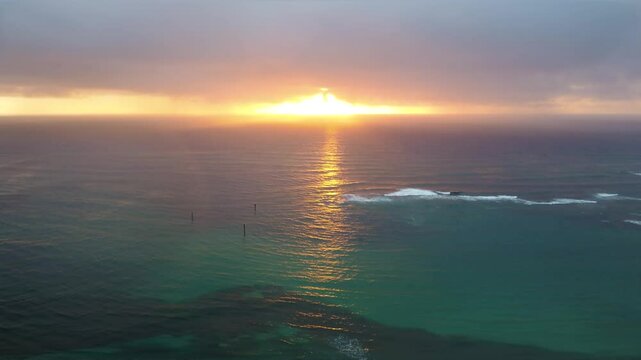 Beautiful view of Kapaa Beach Park, Tropical Hawaiian beach with turquoise blue water in Kauai Hawaii. Kapaa Town During morning golden sunrise, Aerial view. Beautiful kapaa Town in Kauai Hawaii.