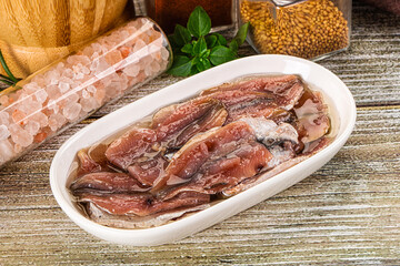 Canned anchovy with oil in the bowl