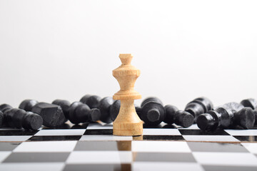 The white chess king defeated the black pieces. Business leader concept and Strategy planning