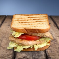 Tasty fresh cheese sandwich on wooden desk