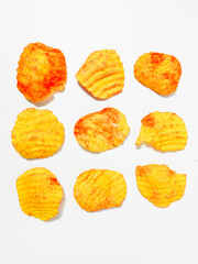 Cassava crackers or cassava crackers, with an additional coating of spicy powder. Isolated white background