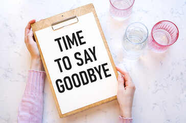 Text TIME TO SAY GOOD on sticker and colored background