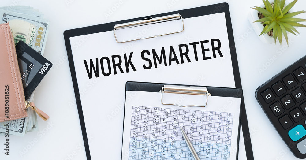 Poster work smarter notepad with text on a white computer keyboard on a wooden background.