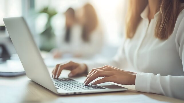 Modern home office scene featuring a focused individual in a comfortable chair,utilizing laptop an web camera for remote hiring success,accompanied by natural lighting ,potted plant decor,and spacious