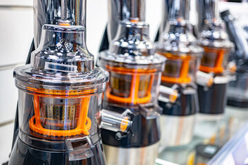 Slow masticating juicers in a household goods store