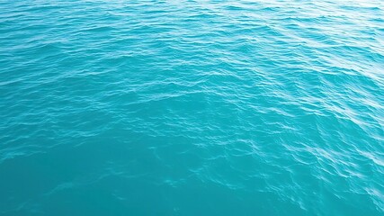 Obraz premium Calm background of turquoise ocean with gentle undulating waves, ocean waves, turquoise ocean
