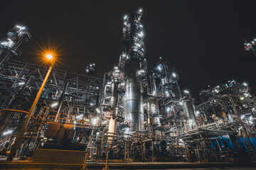 Oil refinery heavy plant from industry zone, night view tank oil and gas petrochemica