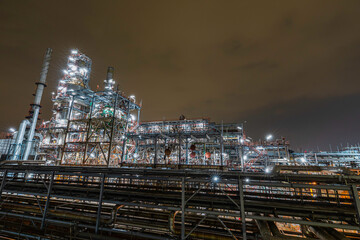 Oil refinery heavy plant from industry zone, night view column oil and gas petrochemical