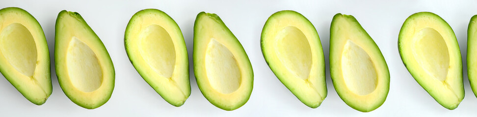 avocado and slices isolated on white background with copy space for your text. Top view. Banner