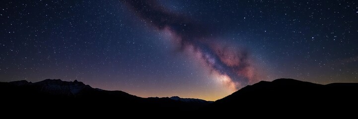 Naklejka premium Under a vibrant star-filled sky the Ukrainian Carpathian Mountains stand as rugged silhouettes against the dark of night, galaxy, hill