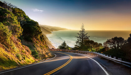 A road winding along the coast in the late afternoon sun with a view of the ocean © Dave