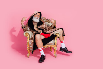 Full body portrait of extravagant egocentric man sit throne weal leopard coat hood empty space...