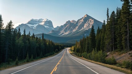 Fototapeta premium Empty stretch of asphalt road running parallel to a mountain range with a clear blue sky above and pine trees in the foreground, peaceful scene, empty highway, asphalt road