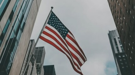 The American flag waving proudly near Wall Street, framed by modern skyscrapers and bustling activity.