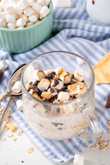 Overnight s`mores oatmeal, Christmas, winter holiday tasty breakfast healthy idea with oats, yogurt, marshmallow, chocolate and creamy sauce
