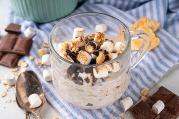 Overnight s`mores oatmeal, Christmas, winter holiday tasty breakfast healthy idea with oats, yogurt, marshmallow, chocolate and creamy sauce