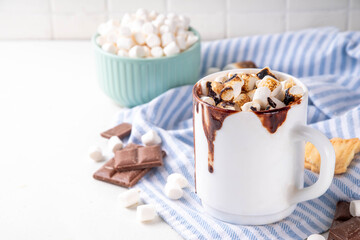 Mug with S`mores hot chocolate or coffee, thick smores hot cocoa or latte drink with toasted marshmallow, graham cracker and chocolate topping