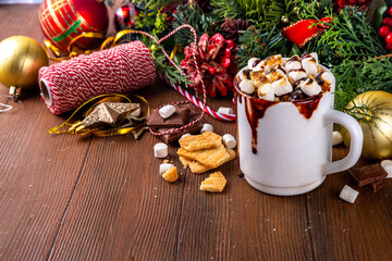Mug with S`mores hot chocolate or coffee, thick smores hot cocoa or latte drink with toasted marshmallow, graham cracker and chocolate topping
