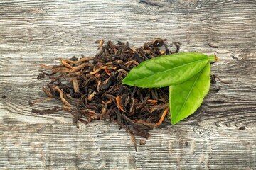 Dry leaves tea on wooden desk
