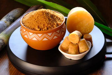 Jaggery Powder, Brown sugar, sugarcane cubes in bowl, Jaggery Powder is a alternative of Sugar and its chemical free powder.